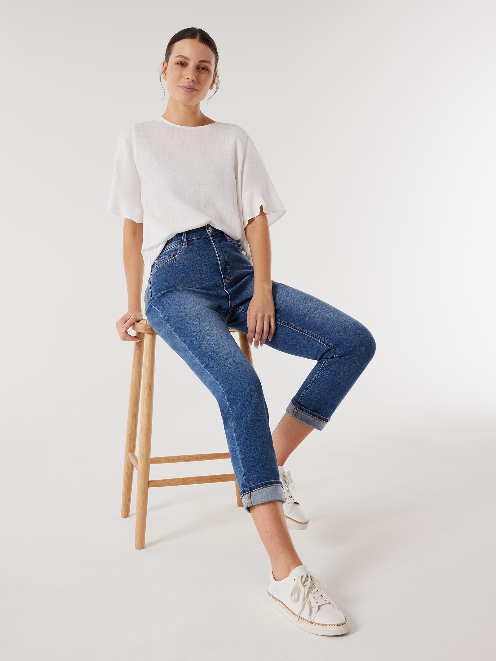 White ruffle top hem jeans